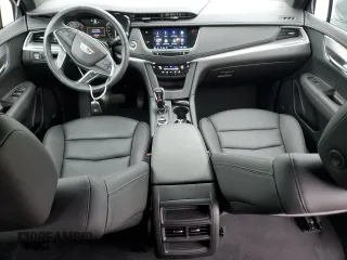 2023 Cadillac XT5 FWD Luxury z VIN 1GYKNAR47PZ144988, wystawiony jako Copart lot #50830365 z przebiegiem 17 687 mil mil oraz Szkody całkowita. Historia ofert i sprzedaży dostępna na DreamBid. Obrazek 8.
