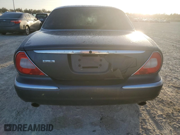 2004 Jaguar XJ with VIN SAJEA74C24SG09038, listed as a Copart auction lot 77015544 with Not Provided miles and Salvage Title. Bid and sale history available at DreamBid. Image 6.