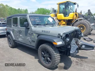 2021 Jeep Wrangler Unlimited Willys z VIN 1C4HJXDNXMW815548, wystawiony jako IAAI lot #42226665 z przebiegiem 55 457 mil mil oraz . Historia ofert i sprzedaży dostępna na DreamBid. Obrazek 1.