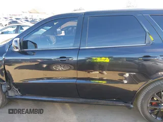 2015 Dodge Durango R/T with VIN 1C4SDHCT5FC937676, listed as a IAAI auction lot 41369508 with 107,075 mi miles and . Bid and sale history available at DreamBid. Image 14.