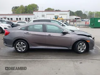 2017 Honda Civic LX z VIN 19XFC2F53HE023730, wystawiony jako IAAI lot #41885003 z przebiegiem 129 595 mil mil oraz . Historia ofert i sprzedaży dostępna na DreamBid. Obrazek 13.