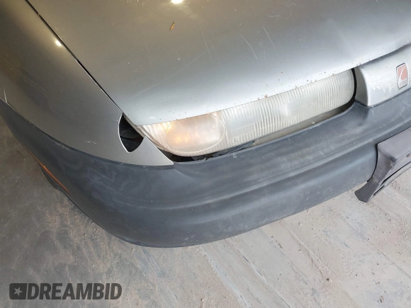 1999 Saturn SL z VIN 1G8ZF5287XZ157353, wystawiony jako IAAI lot #42310900 z przebiegiem 372 049 mil mil oraz . Historia ofert i sprzedaży dostępna na DreamBid. Obrazek 6.