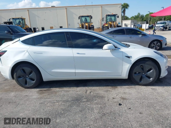2020 Tesla Model 3 Standard Range Plus with VIN 5YJ3E1EA6LF799620, listed as a IAAI auction lot 42221643 with 55,458 mi miles and . Bid and sale history available at carsss.com. Image 12.