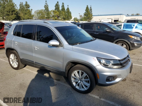 2013 Volkswagen Tiguan S with VIN WVGAV7AX8DW501081, listed as a Copart auction lot 88065365 with 157,312 mi miles and Salvage title. Bid and sale history available at DreamBid. Image 4.