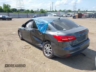 2016 Ford Focus SE with VIN 1FADP3F23GL392347, listed as a IAAI auction lot 39951722 with 143,679 mi miles. Bid and sale history available at carsss.com. Image 3.