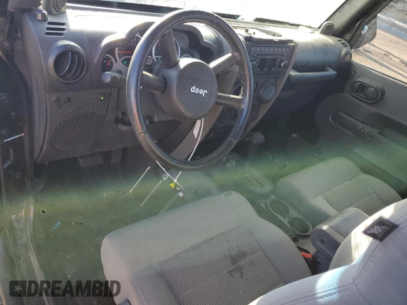 2009 Jeep Wrangler Rubicon with VIN 1J4GA64169L765933, listed as a Copart auction lot 84963104 with 107,190 mi miles and Salvage Title. Bid and sale history available at DreamBid. Image 8.