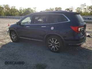 2019 Honda Pilot Touring 8-Passenger z VIN 5FNYF6H90KB000303, wystawiony jako Copart lot #52410585 z przebiegiem 129 190 mil mil oraz Szkoda całkowita • Salvage title. Historia ofert i sprzedaży dostępna na DreamBid. Obrazek 2.