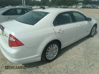 2010 Ford Fusion Hybrid z VIN 3FADP0L31AR387443, wystawiony jako IAAI lot #40034145 z przebiegiem 153 847 mil mil oraz . Historia ofert i sprzedaży dostępna na DreamBid. Obrazek 4.