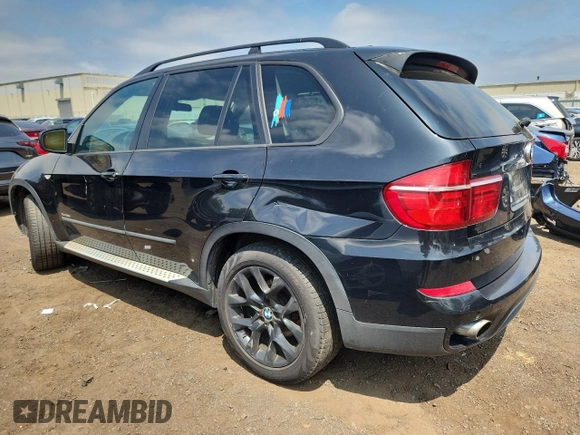 2012 BMW X5 35i with VIN 5UXZV4C5XCL765757, listed as a Copart auction lot 64497535 with 178,836 mi miles and Salvage title. Bid and sale history available at DreamBid. Image 2.