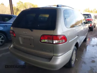 2002 Toyota Sienna LE with VIN 4T3ZF13C72U422993, listed as a IAAI auction lot 41552421 with 260,014 mi miles. Bid and sale history available at carsss.com. Image 4.