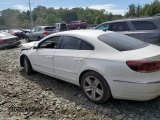 2014 Volkswagen CC Sport with VIN WVWBN7AN3EE528302, listed as a Copart auction lot 69636034 with 77,332 mi miles and Salvage Title. Bid and sale history available at DreamBid. Image 2.
