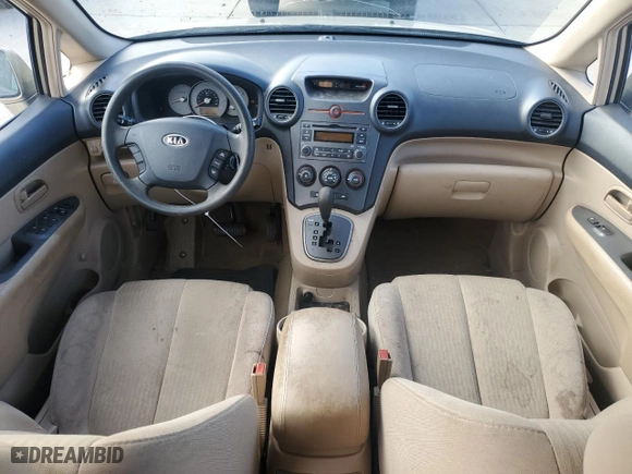 2007 Kia Rondo LX with VIN KNAFG526X77040461, listed as a Copart auction lot 77202004 with 125,132 mi miles and Salvage Title. Bid and sale history available at carsss.com. Image 8.