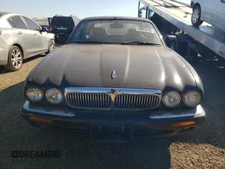 2001 Jaguar XJ with VIN SAJDA23C31LF28667, listed as a Copart auction lot 76983144 with 87,542 mi miles and Clean title. Bid and sale history available at DreamBid. Image 5.