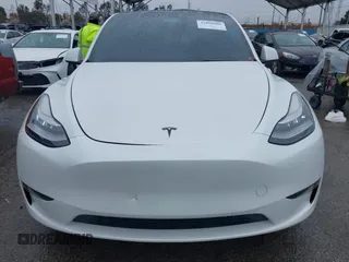 2021 Tesla Model Y Long Range with VIN 5YJYGAEE2MF260142, listed as a IAAI auction lot 41808666 with 87,316 mi miles and . Bid and sale history available at DreamBid. Image 11.