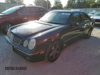 2002 Mercedes-Benz E-Class with VIN WDBJF65J32B494321, listed as a Copart auction lot 77557334 with 198,820 mi miles and Salvage Title. Bid and sale history available at carsss.com. Image 1.