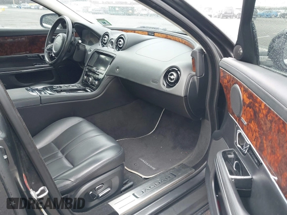 2014 Jaguar XJ with VIN SAJWA1CZ0E8V73966, listed as a IAAI auction lot 41887234 with 120,804 mi miles and . Bid and sale history available at DreamBid. Image 5.