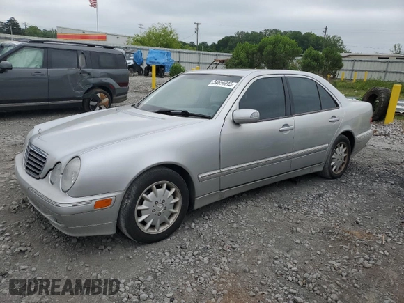 2000 Mercedes-Benz E 320 with VIN WDBJF65J1YB099417, listed as a Copart auction lot 54656915 with 130,387 mi miles and Salvage Title. Bid and sale history available at DreamBid. Image 1.