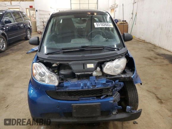 2009 Smart fortwo Pure z VIN WMEEJ31X99K209790, wystawiony jako Copart lot #51102685 z przebiegiem 30 389 mil mil oraz Szkody całkowita. Historia ofert i sprzedaży dostępna na DreamBid. Obrazek 5.
