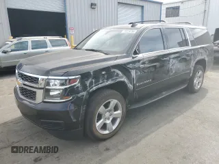 2019 Chevrolet Suburban LS z VIN 1GNSCGKC2KR297407, wystawiony jako Copart lot #75224194 z przebiegiem 93 562 mil mil oraz Szkoda całkowita • Salvage title. Historia ofert i sprzedaży dostępna na DreamBid. Obrazek 1.