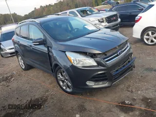 2015 Ford Escape Titanium with VIN 1FMCU0J97FUC20215, listed as a IAAI auction lot 40795632 with 136,331 mi miles. Bid and sale history available at carsss.com. Image 1.