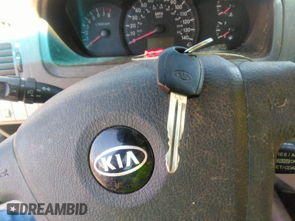2005 Kia Spectra LX with VIN KNAFE121055121500, listed as a IAAI auction lot 39677018 with 142,307 mi miles. Bid and sale history available at carsss.com. Image 11.