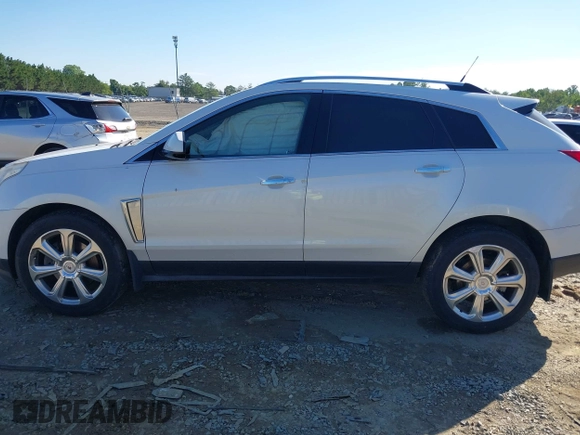 2013 Cadillac SRX Performance Collection with VIN 3GYFNHE31DS597987, listed as a IAAI auction lot 42319058 with 139,670 mi miles and . Bid and sale history available at DreamBid. Image 14.