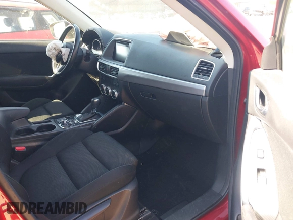 2016 Mazda CX-5 Touring with VIN JM3KE4CY0G0890309, listed as a IAAI auction lot 41890840 with 89,023 mi miles and . Bid and sale history available at carsss.com. Image 5.