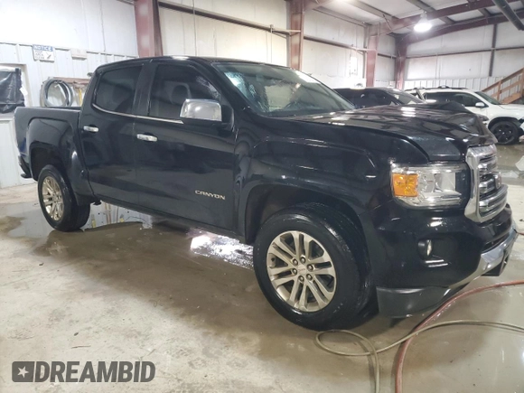 2016 GMC Canyon 2WD SLT with VIN 1GTG5DE39G1100516, listed as a Copart auction lot 87648455 with 243,815 mi miles and Salvage Title. Bid and sale history available at carsss.com. Image 4.