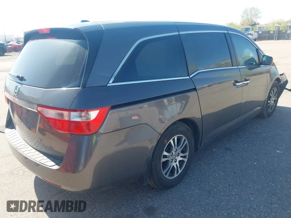 2012 Honda Odyssey EX-L with VIN 5FNRL5H61CB095789, listed as a IAAI auction lot 42065507 with 138,570 mi miles and . Bid and sale history available at DreamBid. Image 4.