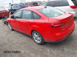 2016 Ford Focus SE z VIN 1FADP3F23GL285640, wystawiony jako IAAI lot #42066370 z przebiegiem 97 007 mil mil oraz . Historia ofert i sprzedaży dostępna na DreamBid. Obrazek 3.