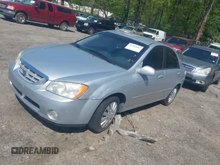 2004 Kia Spectra LX with VIN KNAFE122145037581, listed as a IAAI auction lot 41965681 with 49,817 mi miles. Bid and sale history available at carsss.com. Image 2.