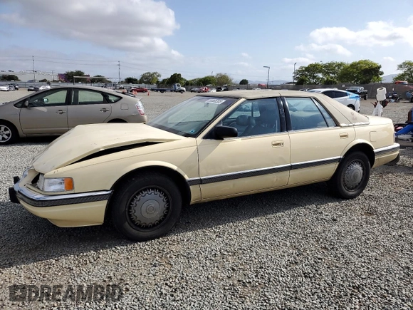 1992 Cadillac Seville z VIN 1G6KS53B0NU837105, wystawiony jako Copart lot #55865205 z przebiegiem 94 740 mil mil oraz Szkody całkowita. Historia ofert i sprzedaży dostępna na DreamBid. Obrazek 1.