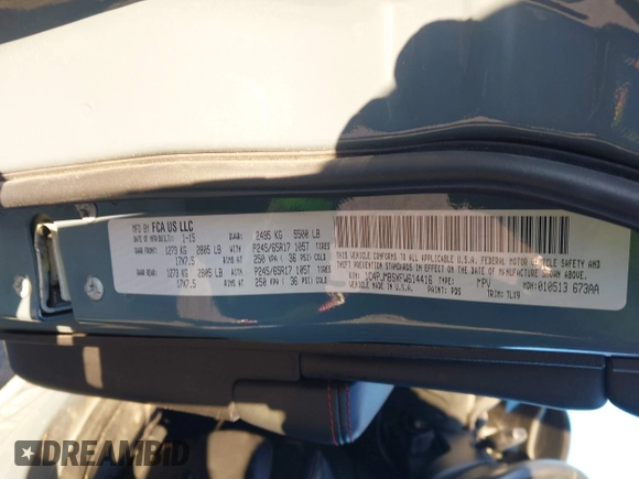 2015 Jeep Cherokee Trailhawk with VIN 1C4PJMBSXFW614416, listed as a IAAI auction lot 41033241 with 112,015 mi miles. Bid and sale history available at carsss.com. Image 9.