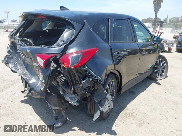 2016 Mazda CX-5 Grand Touring z VIN JM3KE2DY6G0900005, wystawiony jako IAAI lot #42311162 z przebiegiem 80 758 mil mil oraz . Historia ofert i sprzedaży dostępna na DreamBid. Obrazek 4.
