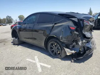 2024 Tesla Model Y Long Range with VIN 7SAYGDEE0RF123793, listed as a Copart auction lot 57177305 with 20,053 mi miles and Salvage title. Bid and sale history available at DreamBid. Image 2.