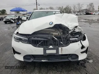 2021 BMW 3 Series 330i with VIN 3MW5R1J0XM8B48990, listed as a Copart auction lot 49277185 with 69,776 mi miles and Salvage Title. Bid and sale history available at carsss.com. Image 5.