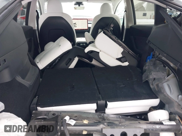 2023 Tesla Model Y Long Range with VIN 7SAYGAEE8PF706706, listed as a IAAI auction lot 41297340 with 24,428 mi miles and . Bid and sale history available at DreamBid. Image 21.