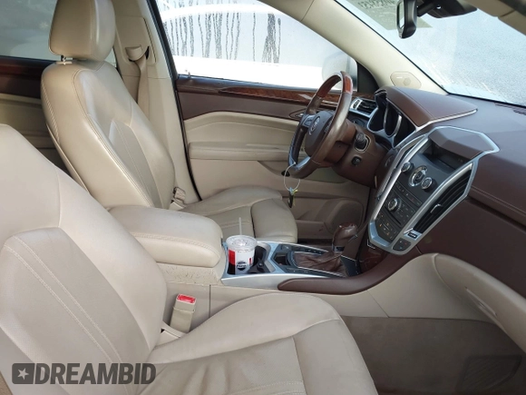 2011 Cadillac SRX Performance Collection with VIN 3GYFNBEY4BS600709, listed as a IAAI auction lot 40858453 with 148,769 mi miles. Bid and sale history available at carsss.com. Image 5.