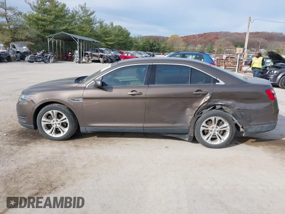 2015 Ford Taurus SEL with VIN 1FAHP2H87FG199865, listed as a IAAI auction lot 40760225 with 77,782 mi miles. Bid and sale history available at carsss.com. Image 14.