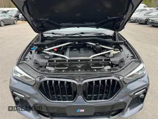 2021 BMW X6 sDrive40i z VIN 5UXCY4C05M9H19479, wystawiony jako Copart lot #54268205 z przebiegiem 85 899 mil mil oraz Czysty tytuł • Clean title. Historia ofert i sprzedaży dostępna na DreamBid. Obrazek 8.