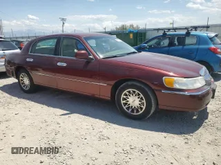 2000 Lincoln Town Car Signature with VIN 1LNHM82W2YY809189, listed as a Copart auction lot 59812665 with 148,236 mi miles and Salvage title. Bid and sale history available at DreamBid. Image 4.