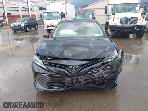 2019 Toyota Camry LE with VIN 4T1B11HK2KU263910, listed as a IAAI auction lot 42060008 with 31,433 mi miles and . Bid and sale history available at DreamBid. Image 12.