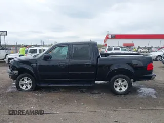 2002 Ford F-150 XLT with VIN 1FTRW08L32KD90202, listed as a IAAI auction lot 41850546 with 256,807 mi miles. Bid and sale history available at carsss.com. Image 14.