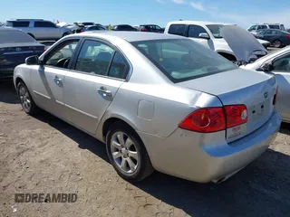 2007 Kia Optima EX with VIN KNAGE124975157963, listed as a IAAI auction lot 41673886 with 128,278 mi miles. Bid and sale history available at carsss.com. Image 3.