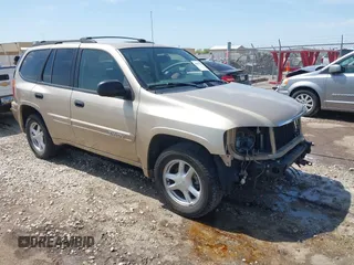 2005 GMC Envoy SLE with VIN 1GKDT13S252264932, listed as a IAAI auction lot 41981566 with 140,566 mi miles. Bid and sale history available at carsss.com. Image 1.
