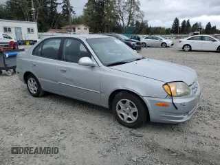 2005 Hyundai Accent GLS z VIN KMHCG45C75U639281, wystawiony jako Copart lot #54887095 z przebiegiem 136 090 mil mil oraz Szkoda całkowita • Salvage title. Historia ofert i sprzedaży dostępna na DreamBid. Obrazek 4.