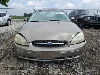 2003 Ford Taurus SES Standard z VIN 1FAFP55U33A123732, wystawiony jako Copart lot #58837395 z przebiegiem 169 159 mil mil oraz Szkoda całkowita • Salvage title. Historia ofert i sprzedaży dostępna na DreamBid. Obrazek 5.