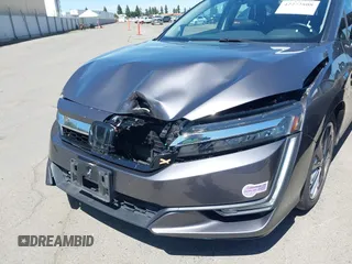 2018 Honda Clarity Touring z VIN JHMZC5F33JC021811, wystawiony jako IAAI lot #42272808 z przebiegiem 82 414 mil mil oraz . Historia ofert i sprzedaży dostępna na DreamBid. Obrazek 6.