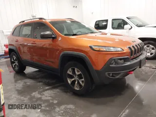 2015 Jeep Cherokee Trailhawk z VIN 1C4PJMBS1FW649197, wystawiony jako IAAI lot #42166234 z przebiegiem 128 929 mil mil oraz . Historia ofert i sprzedaży dostępna na DreamBid. Obrazek 1.