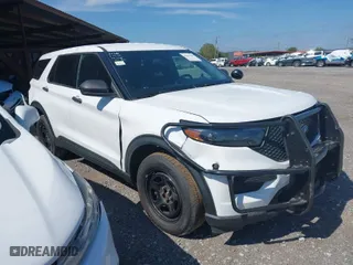 2021 Ford Police Interceptor Utility with VIN 1FM5K8AB0MGB04298, listed as a IAAI auction lot 40204106 with 74,293 mi miles. Bid and sale history available at carsss.com. Image 1.